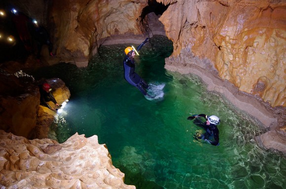 "Cavenauts" exploring an underground lake. Credit: ESA/V. Crobu
