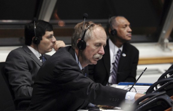Bill Gerstenmaier in Kennedy Space Center's Firing Room 4 for the of space shuttle Discovery on the STS-128 mission in 2009. In the background are Chris Scolese, NASA associate administrator, and Charlie Bolden, NASA Administrator. Credit: NASA