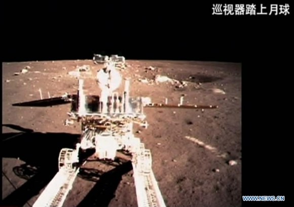 A video grab shows China's first moon rover, Yutu, or Jade Rabbit, separating from Chang'e-3 moon lander early Dec. 15, 2013. The six-wheeled rover separated from the lander early on Sunday, several hours after the Chang'e-3 probe soft-landed on the lunar surface. Credit: Xinhua