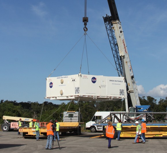 Hoisting Orion heat shield at KSC for transport to Orion crew module in the Operations and Checkout Building. Credit: Ken Kremer/kenkremer.com