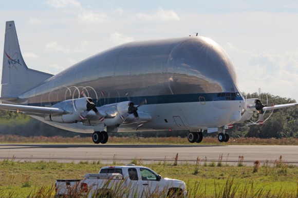 Departure of NASA’s Super Guppy from the shuttle landing runway at the Kennedy Space Center in Florida on Dec. 5, 2013 after removal of Orion heat shield. Credit: Ken Kremer/kenkremer.com