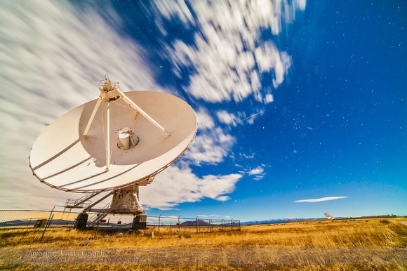 One of the 27 antennas of the Very Large Array (VLA) radio telescope complex illuminated by moonlight, on December 13, 2013, peak night for the Geminid meteor shower. A single Geminid is right of the antenna at centre frame. Credit and copyright: Alan Dyer/Amazing Sky Photography. 