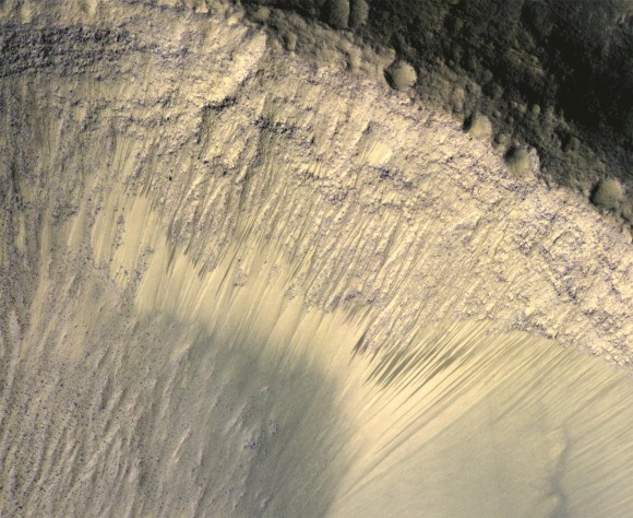 These dark lines on a slope on Mars appear to be changing with the seasons, as portrayed in this image from the Mars Reconnaissance Orbiter's High Resolution Imaging Science Experiment (HiRISE) camera. Credit: NASA/JPL-Caltech/Univ. of Arizona