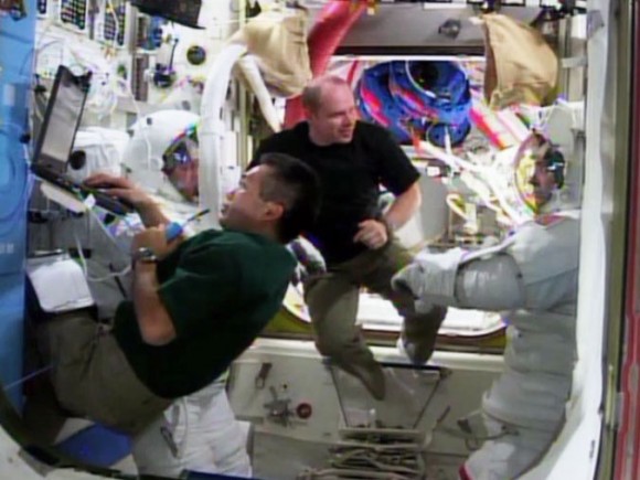 The Expedition 38 crew tests spacesuits in preparation for December spacewalks to replace a pump for the International Space Station's cooling system. In the spacesuits are NASA astronauts Mike Hopkins (left) and Rick Mastracchio. Japanese astronaut Koichi Wakata is in the foreground, with Russian commander Oleg Kotov behind. Credit: NASA TV