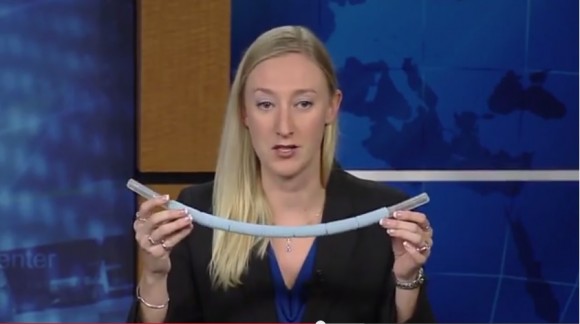 Allison Bolinger, NASA's lead U.S. spacewalk officer, holds up a snorkel-like device that astronauts began using in spacesuits in December 2013. The pipe (modified from spacesuit parts) is supposed to be a backup if a helmet fills with water, as what occurred during a July 2013 spacewalk. Credit: NASA (YouTube/screenshot)