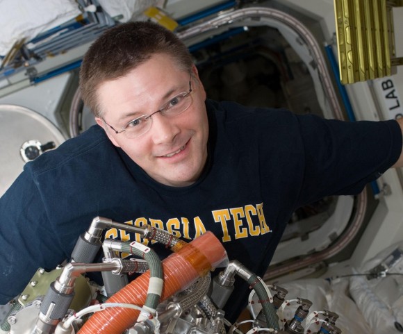 NASA astronaut Doug Wheelock, who was commander of Expedition 25. This 2010 picture of him also shows the Sabatier system that extracts drinkable water from the International Space Station's atmosphere. Credit: NASA