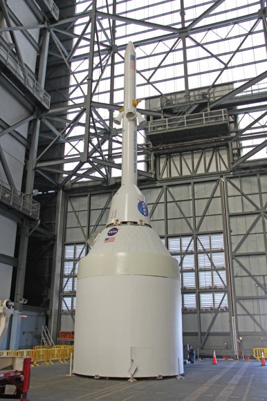Orion crew capsule, Service Module and 6 ton Launch Abort System (LAS) mock up stack inside the transfer aisle of the Vehicle Assembly Building (VAB) at the Kennedy Space Center (KSC) in Florida. Credit: Ken Kremer/kenkremer.com