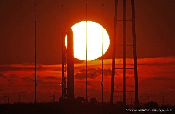 Gorgeous Wallops Sunrise greets Antares rocket poised at Launch Pad 0A on Virginia shoreline. A blast of solar radiation on Jan. 7 postponed Antares blastoff from Jan 8 to Jan 9, 2014. Credit: Mike Killian/mikekillianphotography.com