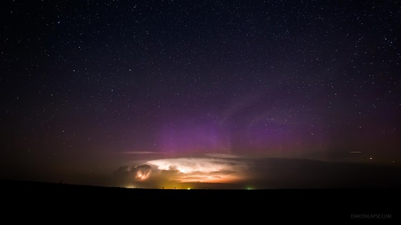 An aurora behind a building storm. From the timelapse 'Huelux.' Credit and copyright: Randy Halverson.