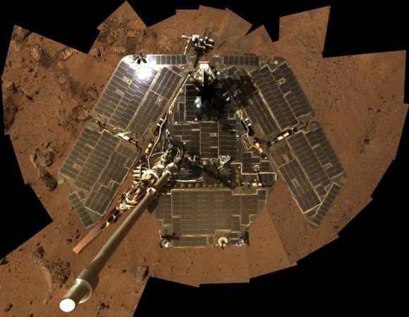 In this selfie, Spirit shows her solar panels gleaming in the Martian sunlight and carrying only a thin veneer of dust two years after the rover landed and began exploring the red planet. Spirit's panoramic camera took this mosaic of images on Sol 586 (Aug. 27, 2005), as part of a mammoth undertaking. The vertical projection used here produces the best view of the rover deck itself, though it distorts the ground and antennas somewhat. This image is an approximate true-color rendering that combines images taken through the camera's 600-nanometer, 530-nanometer and 480-nanometer filters. Credit: NASA/JPL-Caltech/Cornell