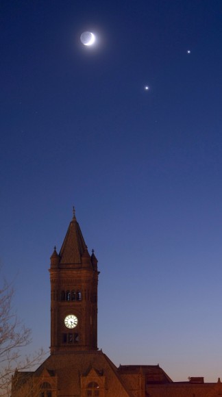 Venus, seen here several years back to the lower right of the moon along with Jupiter, will not only help with focus tonight but will guide toward the thin crescent. Credit: Bob King