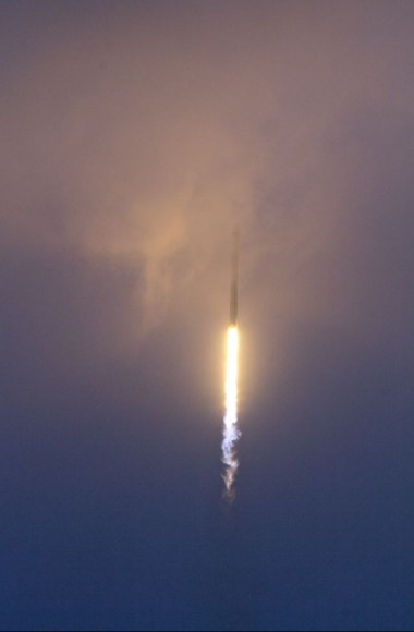 Falcon 9 rocket disappears into the clouds following blastoff on Jan. 6, 2014 from Cape Canaveral, FL. Credit: Jeff Seibert