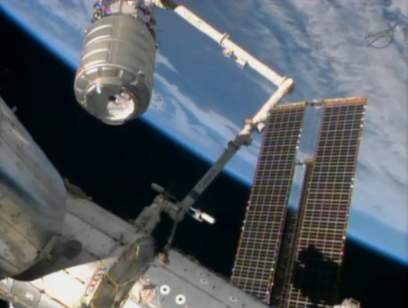 ISS Astronauts grapple Orbital Sciences Cygnus spacecraft with robotic arm and guide it to docking port. Credit: NASA TV