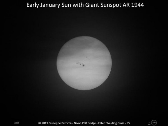 AR144 as seen on January 7, 2014. At the bottom are size comparisons to Earth and Jupiter. Credit and copyright: Giuseppe Petricca.
