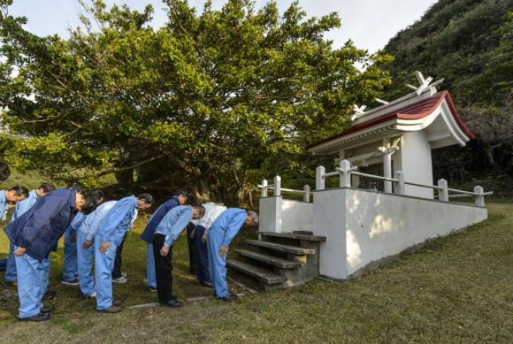 GPM: Three Shrine Pilgrimage Japan Aerospace Exploration Agency (JAXA) team members bow at the Ebisu Shrine, the first shrine in a traditional San-ja Mairi, or Three Shrine Pilgrimage, where the team prays on Tuesday, Feb. 25, 2014 for a successful launch, Tanegashima Island, Japan. Credit: NASA/Bill Ingalls