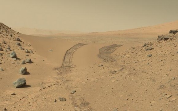 The Curiosity rover looks back at the tracks it left after crossing through the Dingo Gap sand dune. Credit: NASA/JPL, Caltech. Via Doug Ellison on Twitter.