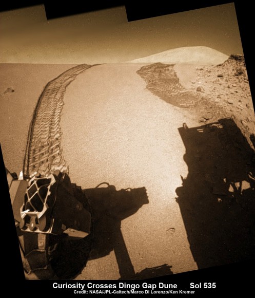 Curiosity looks back to ‘Dingo Gap’ sand dune after crossing over, backdropped by Mount Sharp on Sol 535, Feb. 5, 2014. Hazcam fisheye image linearized and colorized. Credit: NASA/JPL/Marco Di Lorenzo/Ken Kremer- kenkremer.