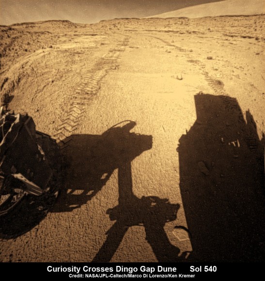 Curiosity looks back to ‘Dingo Gap’ sand dune after crossing over, backdropped by Mount Sharp on Sol 540, Feb. 12, 2014. Rear hazcam fisheye image linearized and colorized. Credit: NASA/JPL/Marco Di Lorenzo/Ken Kremer- kenkremer.com