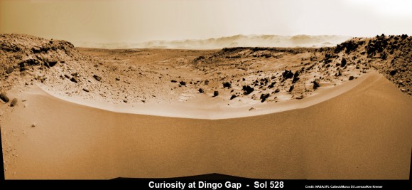 Curiosity's View Past Tall Dune at edge of 'Dingo Gap'  This photomosaic from Curiosity's Navigation Camera (Navcam) taken at the edge of the entrance to the Dingo Gap shows a 3 foot (1 meter) tall dune and valley terrain beyond to the west, all dramatically back dropped by eroded rim of Gale Crater. View from the rover's current position on Sol 528 (Jan. 30, 2014). The rover team may decide soon whether Curiosity will bridge the dune gap as a smoother path to next science destination. Credit: NASA/JPL-Caltech/Marco Di Lorenzo/Ken Kremer- kenkremer.com