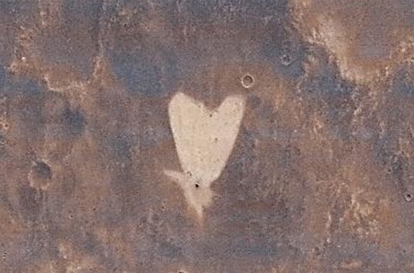 A heart-shaped feature in the Arabia Terra region of Mars taken by NASA's Mars Reconnaissance Orbiter. Image Credit: NASA/JPL-Caltech/MSSS.