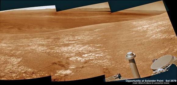 NASA’s Opportunity rover was imaged here from Mars orbit by MRO HiRISE camera on Feb. 14, 2014. This mosaic shows Opportunity’s view today while looking back to vast Endeavour crater from atop Murray Ridge by summit of Solander Point. Opportunity captured this photomosaic view on Feb. 16, 2014 (Sol 3579) from the western rim of Endeavour Crater where she is investigating outcrops of potential clay minerals formed in liquid water. Assembled from Sol 3579 colorized navcam raw images. Credit: NASA/JPL/Cornell/Marco Di Lorenzo/Ken Kremer-kenkremer.com