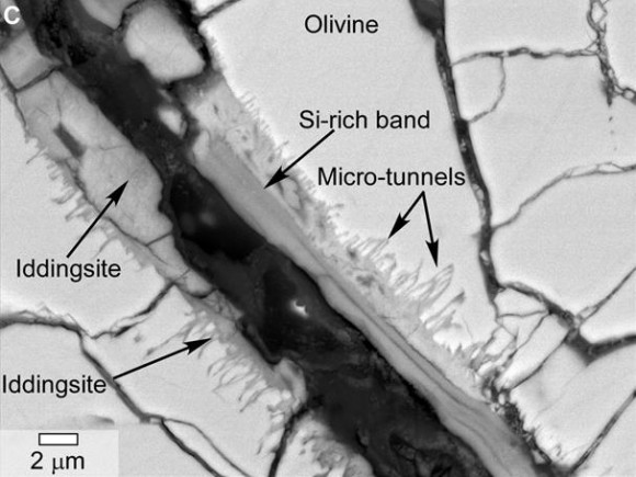 A scanning electron microscope image of a small section of a meteorite found evidence of past water in a Martian meteorite (specifically, in the form of tunnels and microtunnels). The meteorite is called  Yamato 000593. The rock was originally recovered in Antarctica in 2000 and is believed to have come from Mars. Credit: NASA