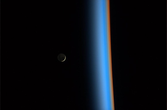 A crescent moon hovers above Earth in this picture snapped by Expedition 38 astronaut Koichi Wakata in 2014. Credit: Koichi Wakata (Twitter)