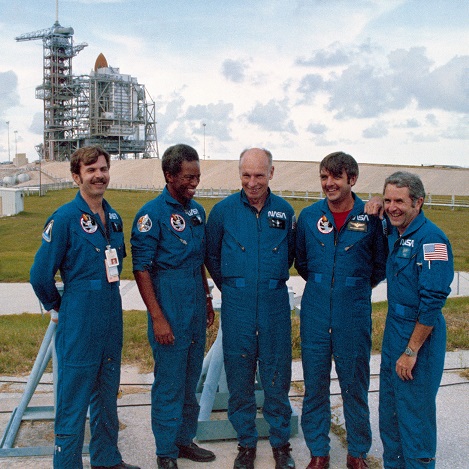Dale Gardner (left) prior to the launch of STS-8 in 1983, along with the rest of his crew. Moving left, Guy Bluford, Bill Thornton, Daniel Brandenstein and Dick Truly. Credit: NASA