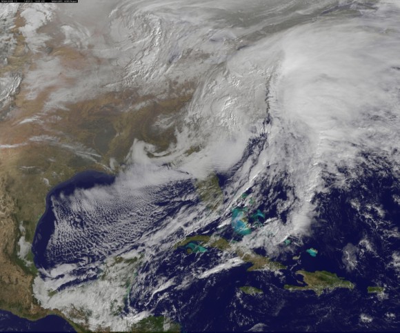 This visible image of the winter storm over the U.S. south and East Coast was taken by NOAA's GOES-13 satellite on Feb. 13 at 1455 UTC/9:45 a.m. EST. Snow covered ground can be seen over the Great Lakes region and Ohio Valley. Image Credit:  NASA/NOAA GOES Project