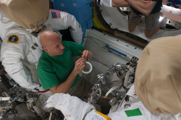 European Space Agency astronaut Luca Parmitano does spacesuit maintenance prior to July 9 and 16, 2013 spacewalks. Parmitano was a member of Expeditions 36 and 37. Credit: NASA