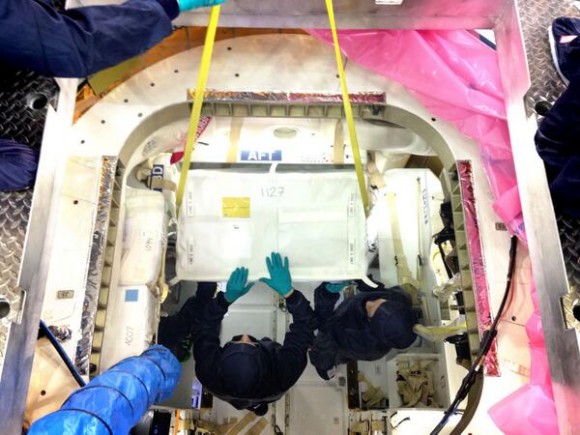 Engineers pack Dragon with cargo, including support for more than 150 science investigations on the ISS. Credit: SpaceX