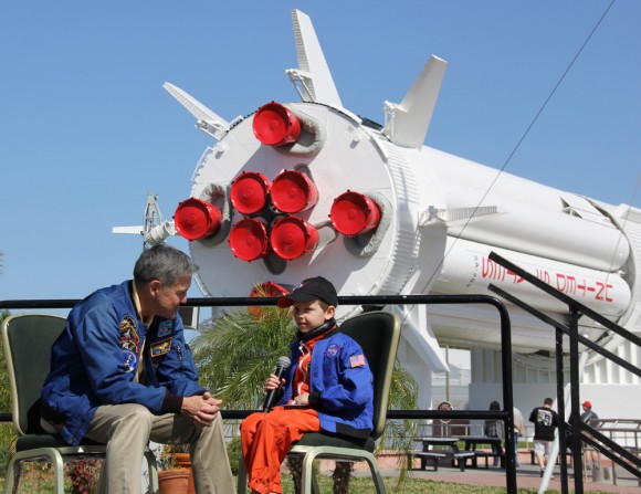 Connor Johnson, 6, talks with former space shuttle commander Bob Cabana, director of Kennedy Space Center, about spaceflight during a ceremony Saturday, March 15, at the Kennedy Space Center Visitor Complex. Johnson, of Denver, Colo., initiated a petition to the White House to maintain NASA funding.  Credit: Ken Kremer - kenkremer.com