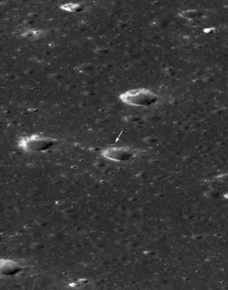 LRO slewed 54 degrees to the east on Feb. 16, 2014, to allow the LROC instrument to snap a dramatic oblique view of the Chang'e 3 site (arrow). Crater in front of lander is 450 meters (about 1,476 feet) in diameter. Image width is 2,900 meters (about 9,500 feet) at the center. Credit: NASA/Goddard/Arizona State University