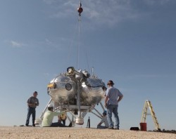 Engineers prepare the Morpheus craft for its FF9 test flight on March 11, 2014 (NASA)