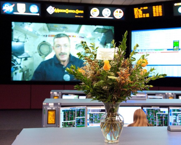 Flowers on a console in NASA Mission Control in 2011 for American Thanksgiving. The bouquets are regular gifts from the Shelton/Murphy families in Texas, who have been sending flowers regularly since shuttle mission STS-26 in 1988. Credit: NASA