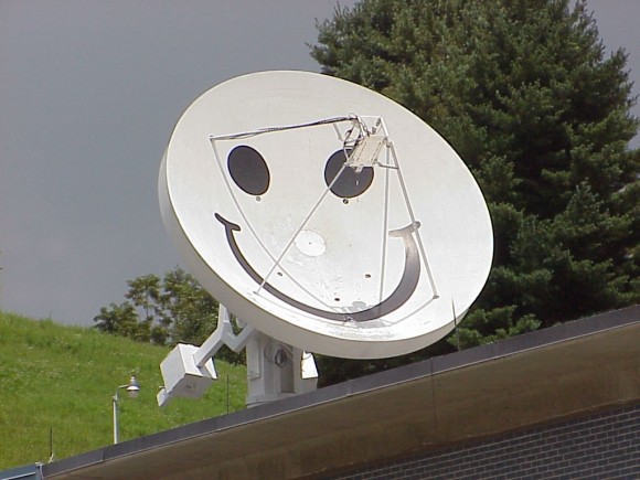 The 4.6 meter "smiley" dish at the Pisgah Astronomical Research Institute, soon to be available for student use via the internet. the dish was formerly used by the military, and the "face" was used to taunt any spy satellites passing overhead! (Credit: SETI League photo used by permission under SETI's fair use policy).