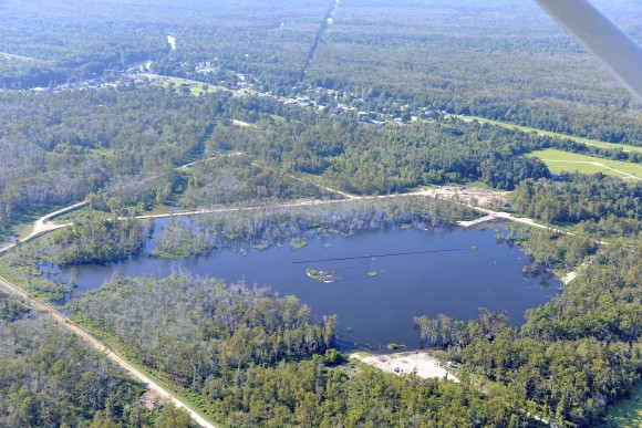 A 25-acre sinkhole near Bayou Corne, Louisiana that formed in Aug. 2012. An analysis of NASA radar data found that the sinkhole was evident in that information before its collapse. Credit: On Wings of Care, New Orleans, La.