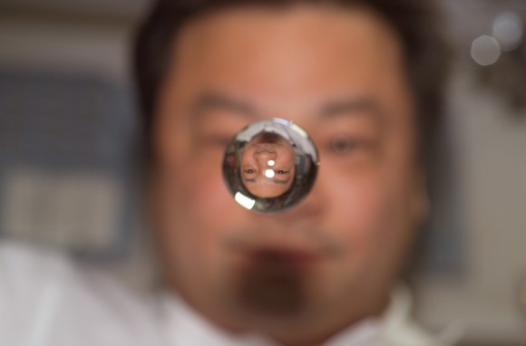 Expedition 10 commander Leroy Chiao is reflected in a water sphere on board the International Space Station in 2004. Credit: NASA