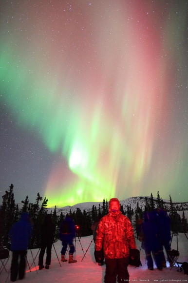 John Chumack stand under the Aurora Borealis near Fairbanks, Alaska on March 25, 2014. Credit and copyright: John Chumack. 