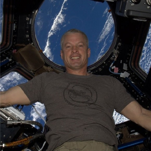 "Back on ISS, life is good," wrote NASA astronaut Steve Swanson on April 7, 2014 in the first Instagram from space. Swanson is wearing a T-shirt from the TV space show 'Firefly' that says "Shipping & Logistics: Everything's Shiny" around a smaller circle reading "Serenity: Est. 2459." Credit: NASA/Instagram