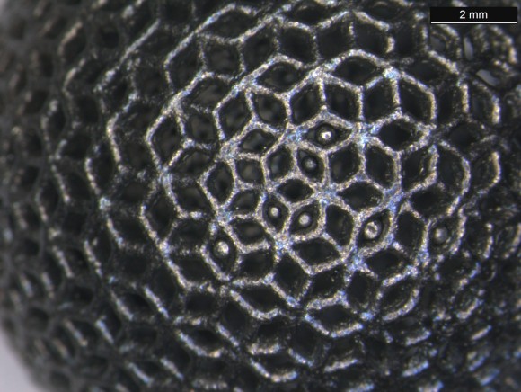 A closeup of a titanium lattice ball made using a 3-D printer. According to the European Space Agency, the hollow spheres have a "complex external geometry" that cannot be made with the usual manufacturing processes. Credit: ESA