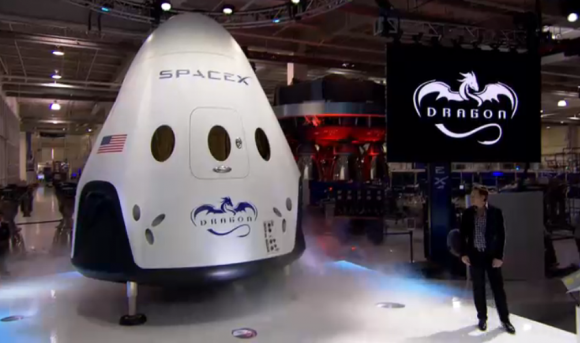 Meet Dragon V2 - SpaceX CEO Elon pulls the curtain off manned Dragon V2 on May 29, 2014 for worldwide unveiling of SpaceX's new astronaut transporter for NASA. Credit: SpaceX