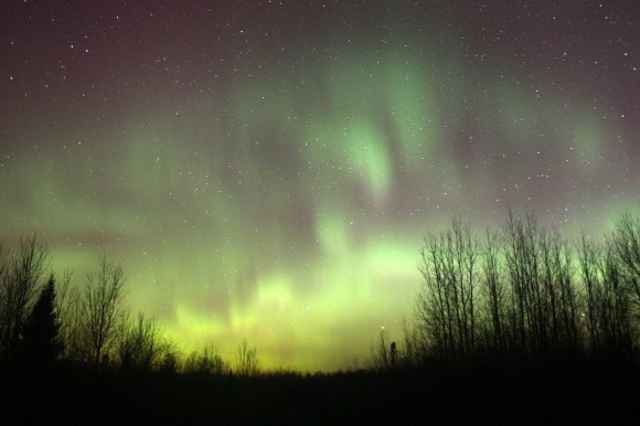 Around 2 o'clock the northern lights displayed flaming when ripples of light pulse from top to bottom. It's very difficult to photograph, but here it is anyway! Credit: Bob King