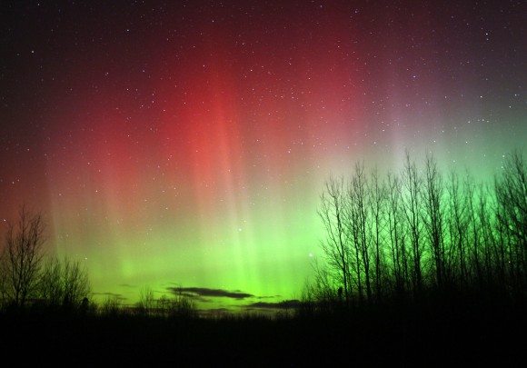 Just when you thought it was over, the whole northern sky burst into rays around 1 a.m. CDT. The whole northern sky lit up with green and red rays earlier this morning. While the green color was easy to see, the red was very pale. The human eye is much more sensitive to green light than red, one of the reasons why the aurora rarely appears red except in a camera during a time exposure. Credit: Bob King