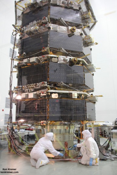 Technicians work on NASA’s 20-foot-tall Magnetospheric Multiscale (MMS) mated quartet of stacked observatories in the cleanroom at NASA's Goddard Space Flight Center in Greenbelt, Md., on May 12, 2014. Credit: Ken Kremer- kenkremer.com