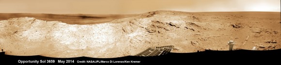 NASA's Opportunity Mars rover captures sweeping panoramic vista near the ridgeline of 22 km (14 mi) wide Endeavour Crater's western rim. The center is southeastward and the distant rim is visible in the center. An outcrop area targeted for the rover to study is at right of ridge.  This navcam panoram was stitched from images taken on May 10, 2014 (Sol 3659) and colorized.  Credit: NASA/JPL/Cornell/Marco Di Lorenzo/Ken Kremer-kenkremer.com