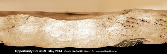 NASA's Opportunity Mars rover captures sweeping panoramic vista near the ridgeline of 22 km (14 mi) wide Endeavour Crater's western rim. The center is southeastward and the distant rim is visible in the center.  See the complete panorama below showing an outcrop area targeted for the rover to study. This navcam panoram was stitched from images taken on May 10, 2014 (Sol 3659) and colorized.  Credit: NASA/JPL/Cornell/Marco Di Lorenzo/Ken Kremer-kenkremer.com 