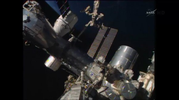 Canada’s Dextre manipulator attached to Canadarm2 conducts external cargo transfers from the SpaceX Dragon resupply ship. Credit: NASA TV