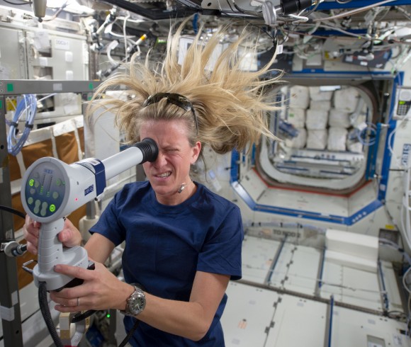 Expedition 36/37 astronaut Karen Nyberg uses a fundoscope to take still and video images of her eye while in orbit. Credit: NASA