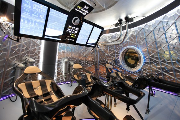 The Dragon V2 spacecraft's seating arrangement with the control panel swung up to allow crewmembers to get into their seats. Once the crew is in place, the control panel swings down and locks in launch position. Credit: NASA/Dimitri Gerondidakis